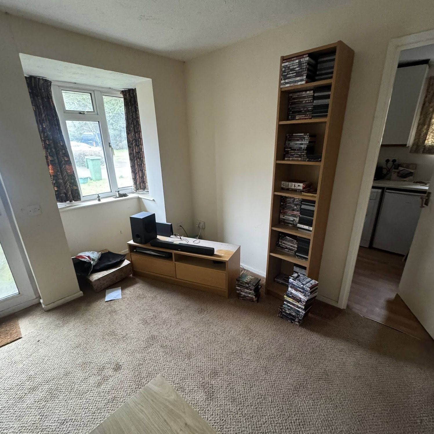 General waste and abandoned belongings in the living room requiring removal