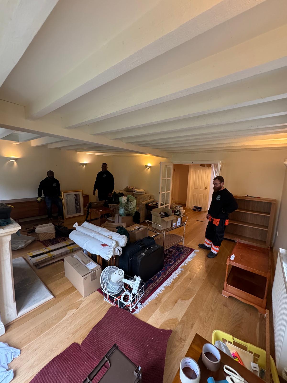 cluttered living room before house clearance