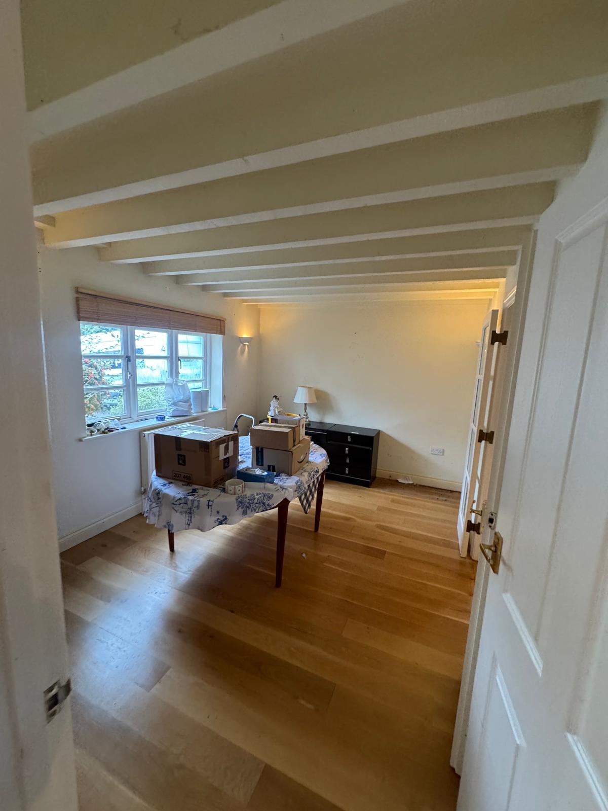 cluttered room with boxes and table