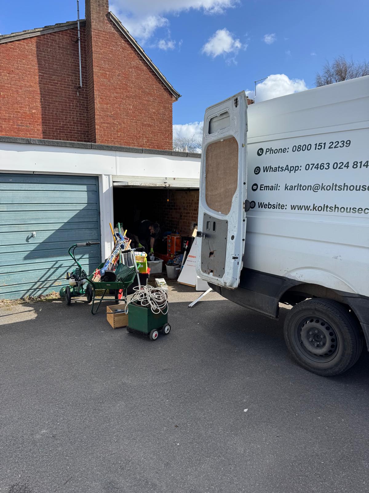 garage clearance in progress with van open