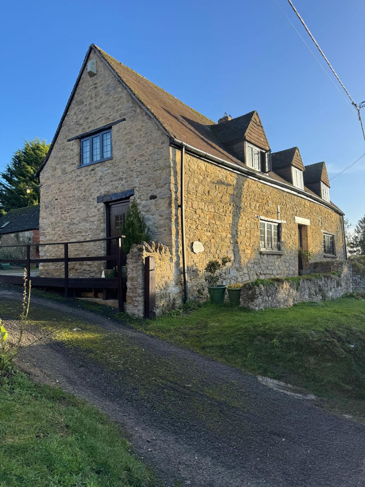 stone house with clear blue sky