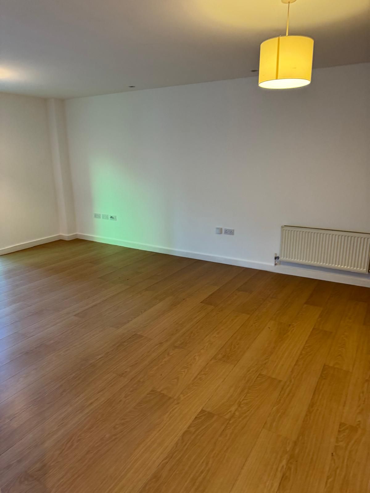 room with wooden floor that has been cleared