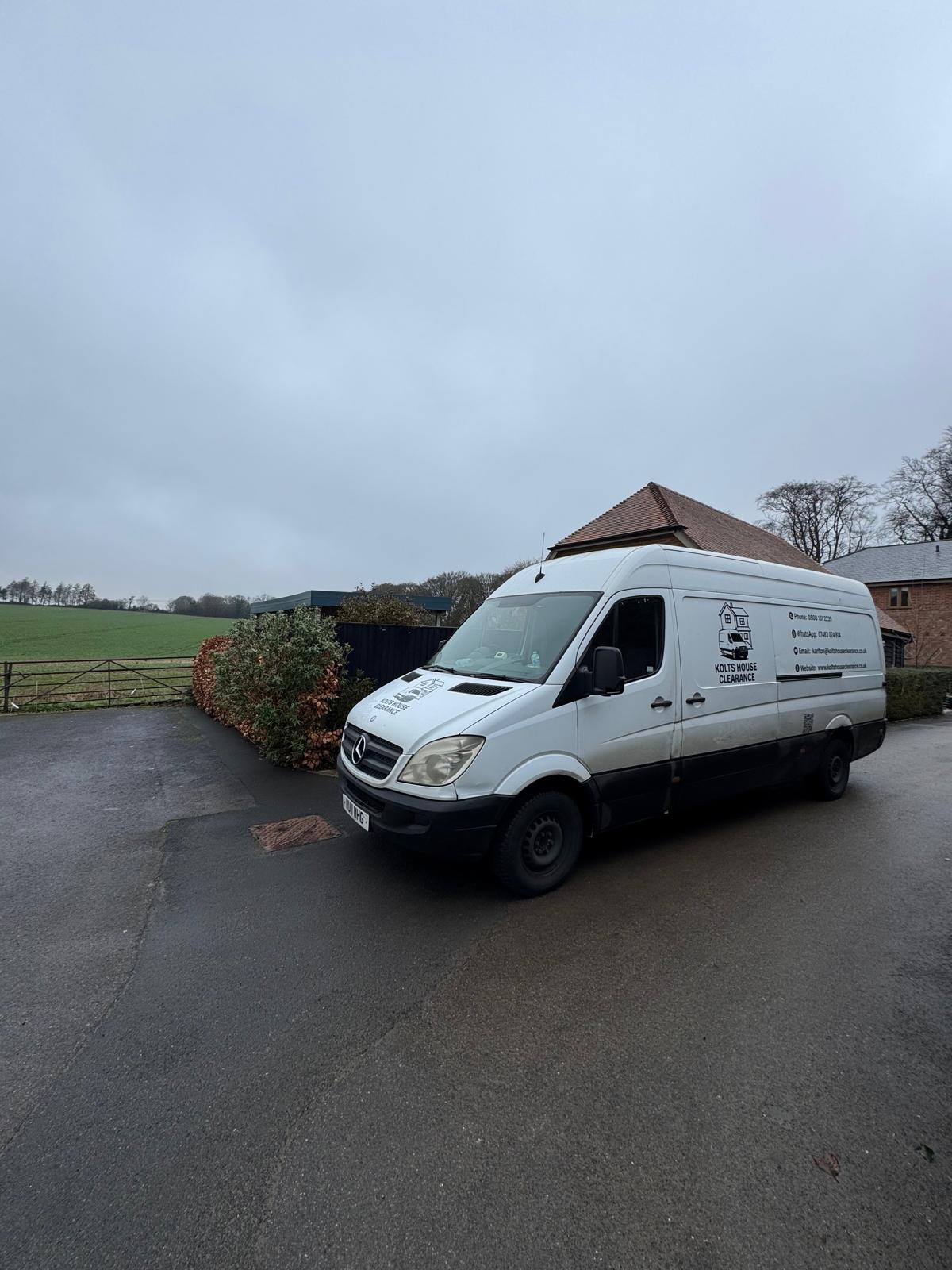 A professional Kolts House Clearance Mercedes Sprinter van parked on a residential road in Berkshire