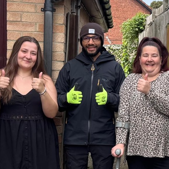 happy customers standing with Karlton